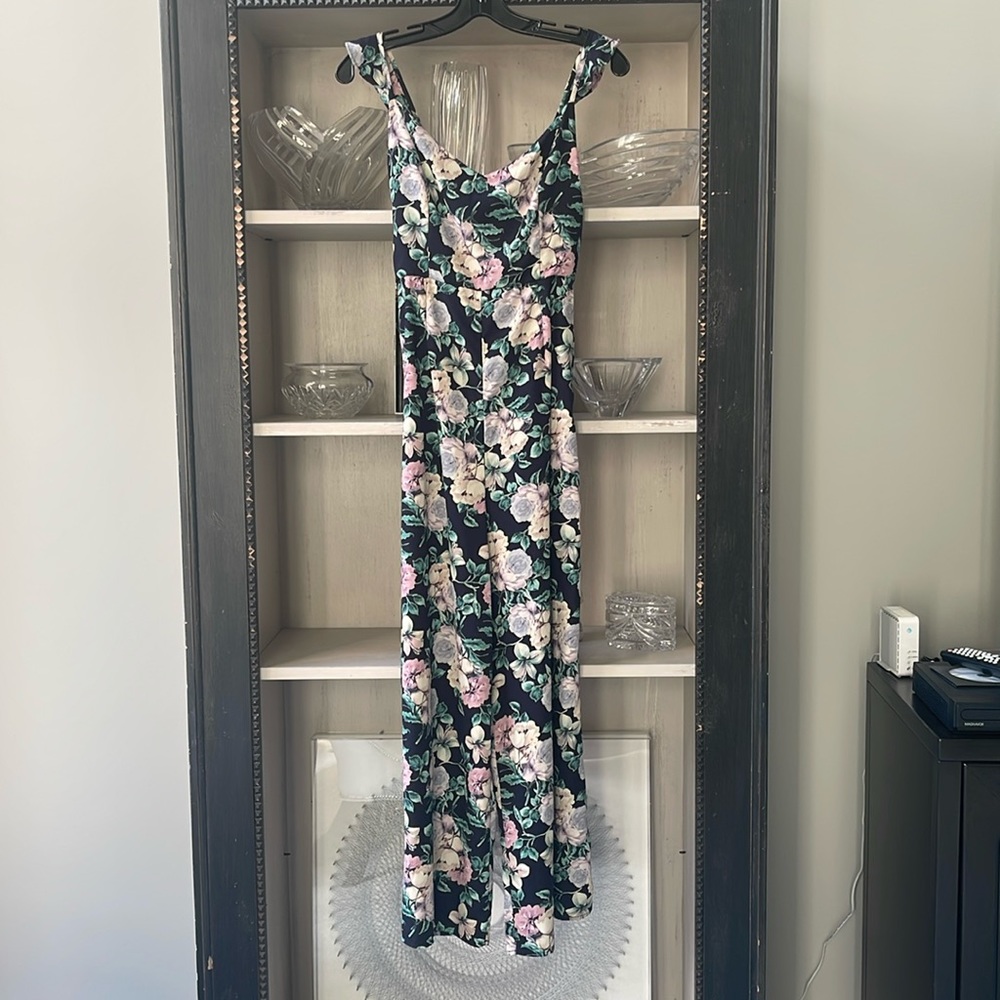 Floral and Navy wide leg jumpsuit with adjustable tie on back. Size S